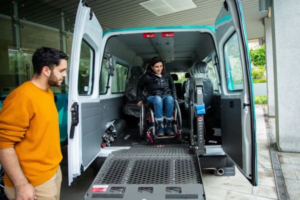 Interior of wheelchair accessible taxi with extra space for carers and family members